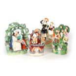 A SELECTION OF FOUR 19TH CENTURY STAFFORDSHIRE FIGURE GROUPS comprising one with musicians and sheep