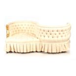 A 19TH CENTURY SERPENTINE SHAPED BUTTON UPHOLSTERED LOVE SEAT standing on square tapering legs