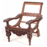 AN UNUSUAL EARLY/MID 19TH CENTURY EASTERN/SOUTH SEAS RECLINING LOUNGE CHAIR with swivelling