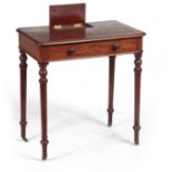 AN EARLY 19TH CENTURY MAHOGANY WRITING TABLE IN THE MANER OF GILLOWS having a lift-up pen and ink