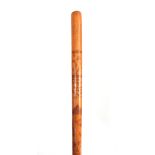A MID 19th CENTURY IRISH FOLK ART WALKING CANE the stick finely engraved all over with various