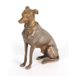 A LATE 19th CENTURY NOVELTY INKWELL modelled as a gilt metal greyhound with amber glass eyes
