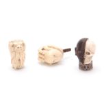 A COLLECTION OF THREE EARLY 20th CENTURY CARVED IVORY WALKING STICK HANDLES one modelled half as a