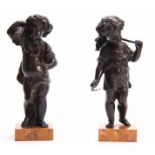 A PAIR OF 19TH CENTURY BRONZE FIGURES OF CHILDREN both depicted standing, one holding a sickle the