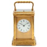 A 19TH CENTURY FRENCH GILT BRASS ENGRAVED GORGE CASE CARRIAGE CLOCK REPEATER with folding handle and