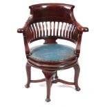 AN EARLY 20th CENTURY MAHOGANY CAPTAINS CHAIR with swivel action seat on cabriole legs and shaped