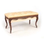 A 19TH CENTURY FRENCH CARVED BEECHWOOD PIANO STOOL with an upholstered hinged top revealing a