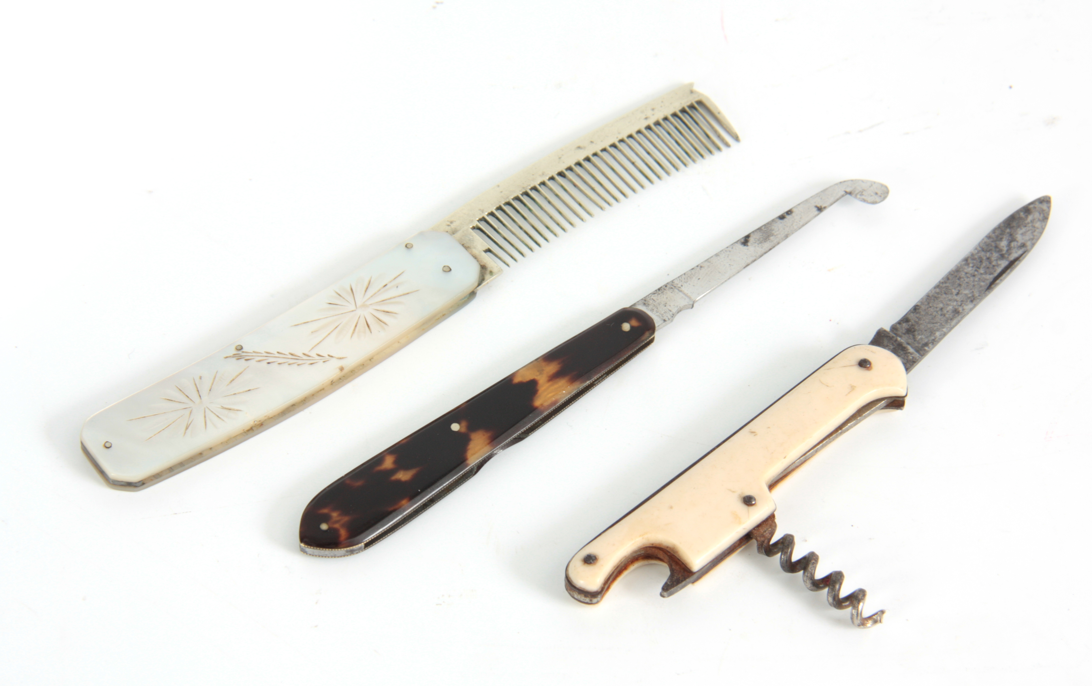 A 19TH CENTURY COMB with engraved mother of pearl handle and silver comb, TOGETHER WITH A SURGEONS