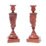 AN UNUSUAL PAIR OF GEORGE III YEW WOOD TREEN CANDLESTICKS with turned square bases knotted burr wood