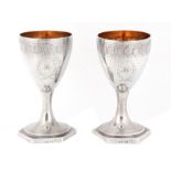 A FINE PAIR OF LATE 18th CENTURY SILVER AND GILT GOBLETS having bright cut foliate engraved