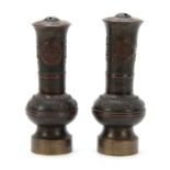 A PAIR OF LATE 19th CENTURY CHINESE OPIUM PIPES modelled as a pair of vases with character marks and