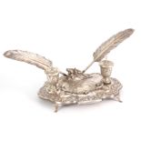 AN EARLY 20TH CENTURY CONTINENTAL SILVER DESK STAND / INKWELL of classical design with leaf cast