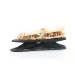 A CHINESE CANTON IVORY SCULPTURE modelled as two mussel shells slightly opened revealing an