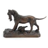 A LATE 19th CENTURY PATINATED BRONZE SCULPTURE modelled as a gun dog with rabbit in mouth standing