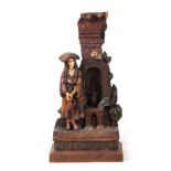 A LATE 19TH CENTURY TERRACOTTA SCULPTURE OF A SPANISH LADY STOOD AT A WATER FOUNTAIN signed with