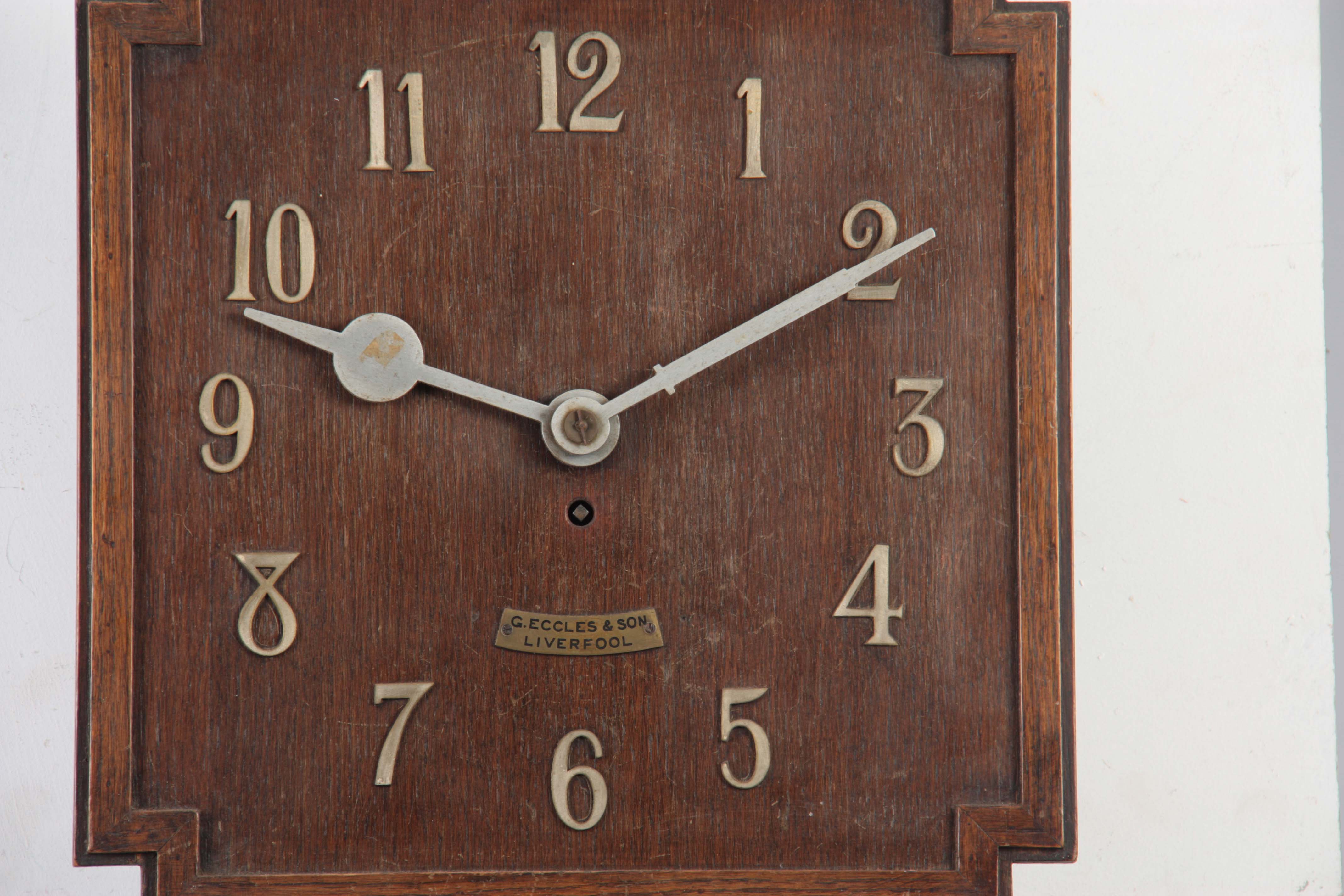 G. ECCLES & SON, LIVERPOOL. AN OAK ART DECO FUSEE WALL CLOCK the 38cm squared dial with applied - Image 3 of 10