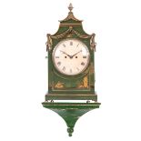 AN ENGLISH REGENCY CHINOISERIE PAGODA TOP BRACKET CLOCK the green painted case decorated with gilt