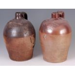 TWO 18TH CENTURY 2 GALLON FULHAM SALT GLAZED STONEWARE ALE JUGS with impressed names to the fronts