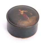 A 19TH CENTURY PAPIER MACHE AND LACQUER WORK CIRCULAR BOX with painted scene to the lid of a young