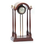 AN EARLY 20th CENTURY FRENCH GRAVITY CLOCK having a mahogany break arch top portico style case