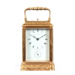 A LATE 19TH CENTURY FRENCH FULLY ENGRAVED GORGE CASED REPEATING CARRIAGE CLOCK the foliate and