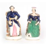 A PAIR OF 19TH CENTURY STAFFORDSHIRE FIGURES depicting Victoria and Albert 17cm high.
