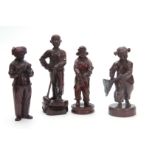 A SET OF FOUR CHINESE CULTURAL REVOLUTION CARVED HARDWOOD FIGURES modelled as boys and girls dressed