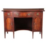 A GEORGE III SERPENTINE FRONTED DRESSING CHEST with fitted kneehole flanked by two banks of