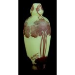 AN ART NOUVEAU CAMEO GLASS VASE BY DEVEZ having a pale green ground with brown overlayed glass