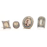 A SET OF FOUR LATE 19TH CENTURY MICRO MOSAIC PICTURE FRAMES decorated with flowers 8cm high and
