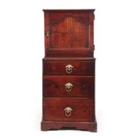 AN EARLY 18TH CENTURY WALNUT SPICE CUPBOARD ON CHEST having a shaped panelled top door revealing a