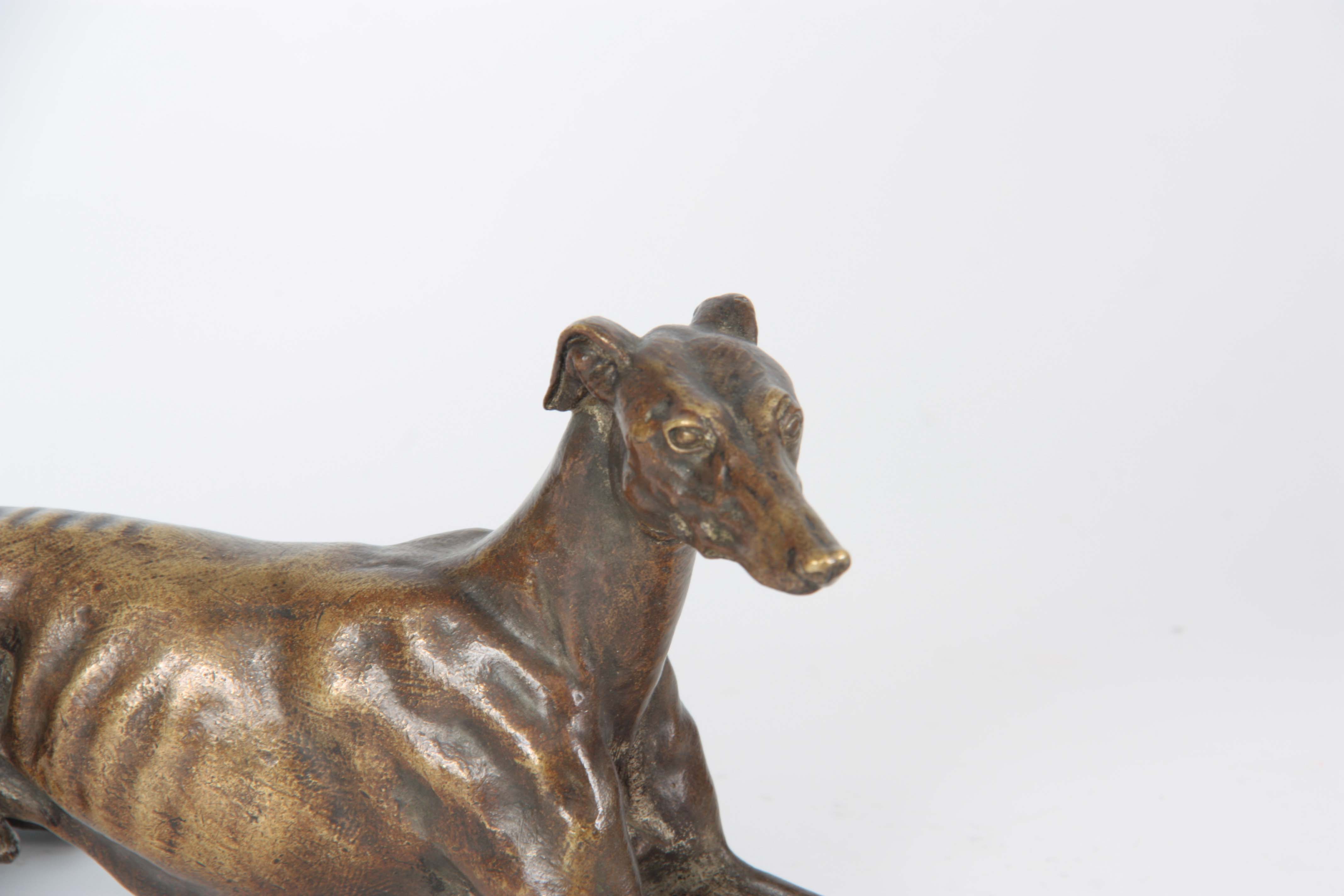 A LATE 19th CENTURY PATINATED BRONZE SCULPTURE modelled as a recumbent greyhound 26cm long - Image 2 of 6