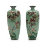 A PAIR OF JAPANESE MEIJI PERIOD CLOISONNE ENAMEL VASES having mint green ground decorated with