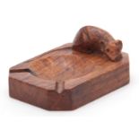 A ROBERT MOUSEMAN THOMPSON OAK ASHTRAY of clipped and rounded rectangular form with carved mouse