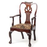 A GOOD GEORGE II MAHOGANY IRISH OPEN ARMCHAIR with shaped gadrooned top rail above a scrolled back