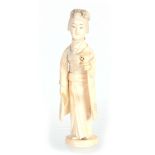 A JAPANESE MEIJI PERIOD IVORY OKIMONO modelled as a Geisha with lamp 16.5cm high, signed to