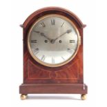 AN EDWARDIAN MAHOGANY DOUBLE FUSEE QUARTER CHIMING BRACKET CLOCK the break arched case with