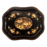 A 19TH CENTURY SCALLOPED BLACK LACQUER AND CHINOISERIE DECORATED PAPIER MACHE TRAY with central