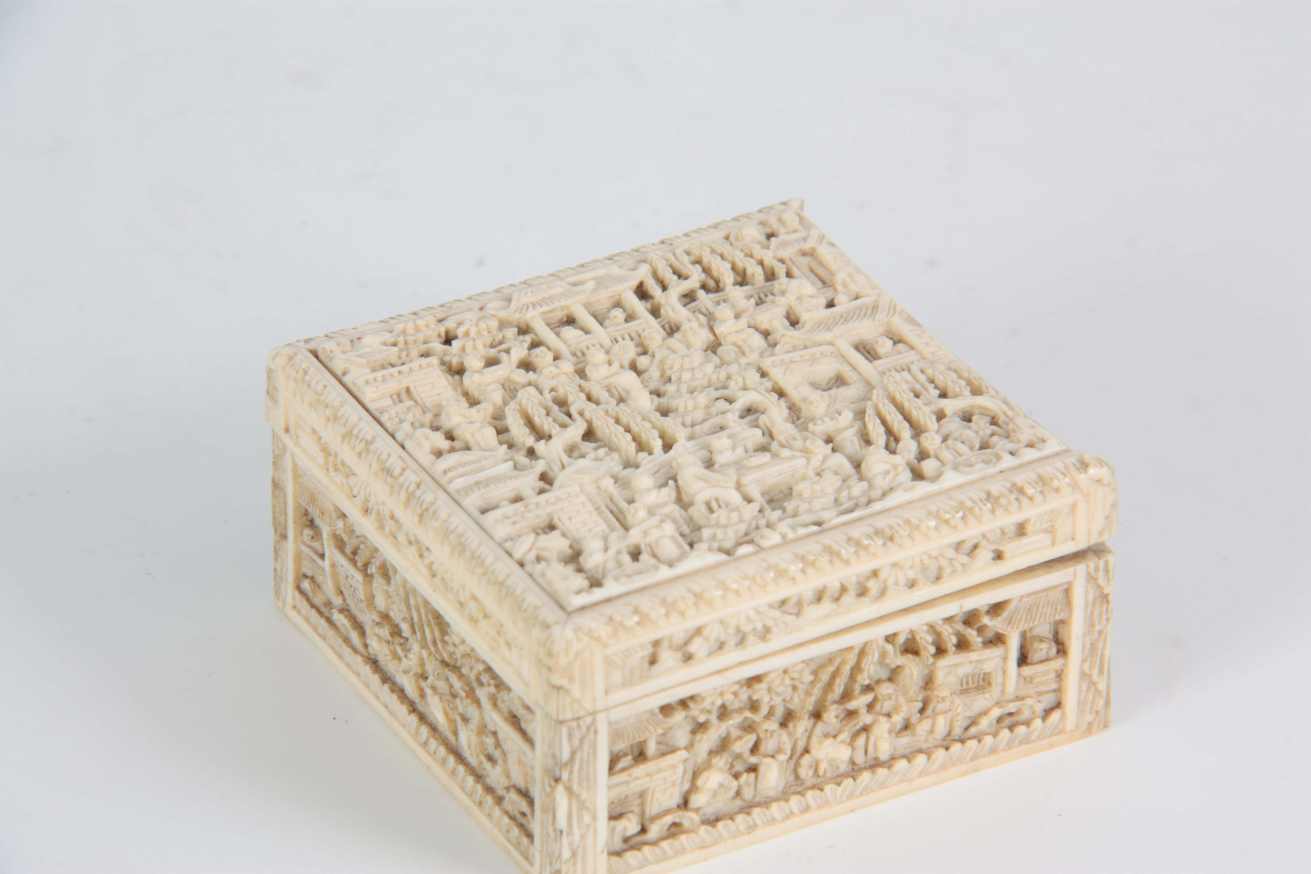 A 19TH CENTURY CHINESE CANTON CARVED IVORY LIDDED BOX finely decorated with figures seated under - Image 2 of 3