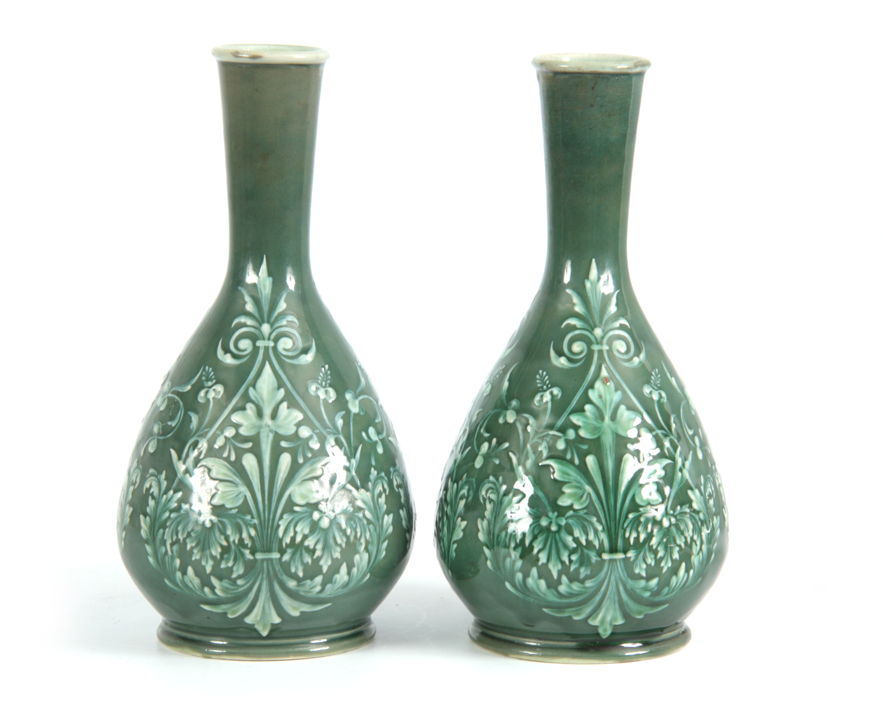 A PAIR OF 19TH CENTURY DOULTON LAMBETH PATE SUR PATE DECORATED VASES decorated with foliage