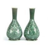A PAIR OF 19TH CENTURY DOULTON LAMBETH PATE SUR PATE DECORATED VASES decorated with foliage