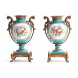 A PAIR OF 19TH CENTURY FRENCH ORMOLU MOUNTED SEVRES STYLE URN-SHAPED VASES with square raised