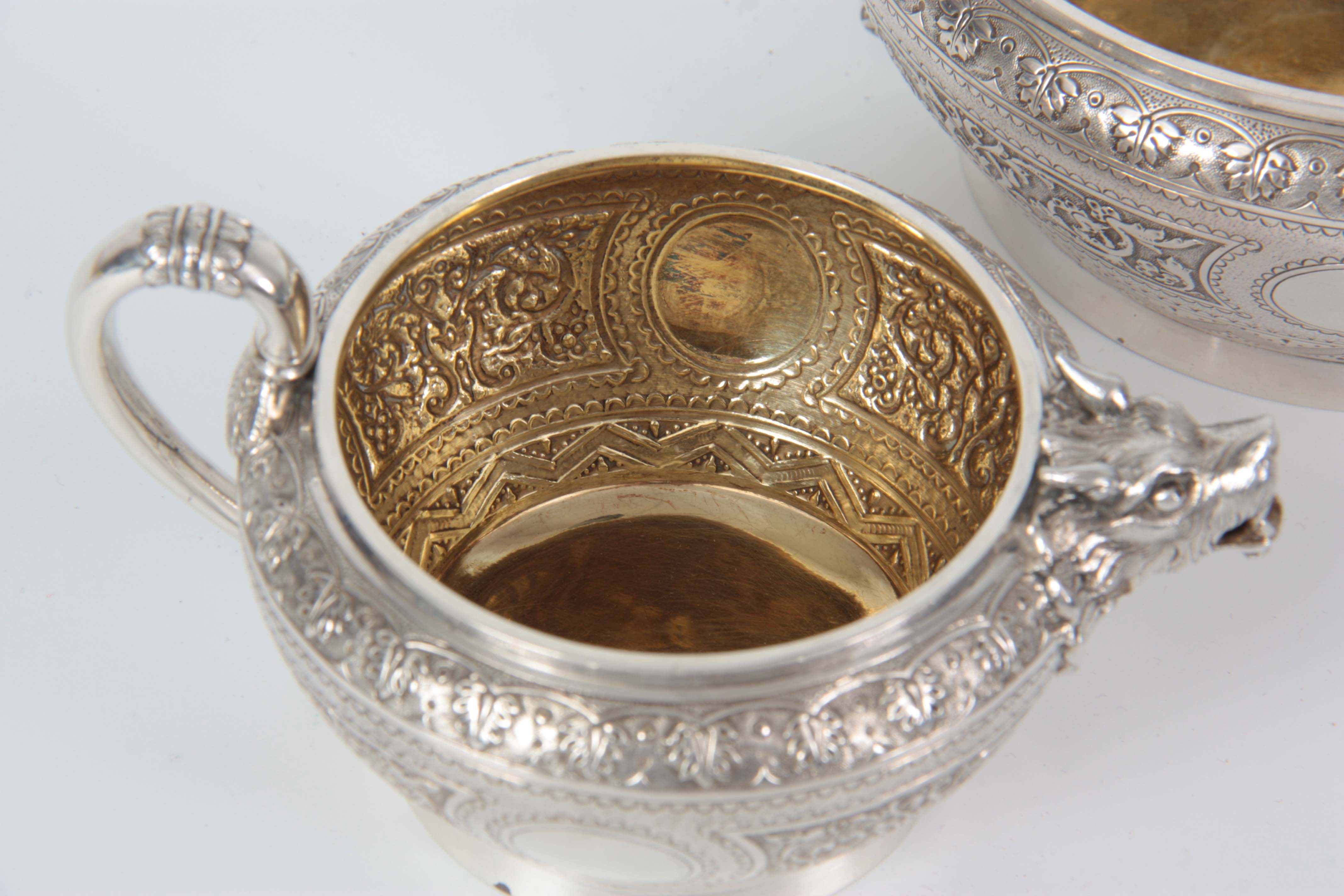 A VICTORIAN SILVER AND GILT CREAM JUG AND SUGAR BOWL having relief scroll-work panels and fine - Image 5 of 7