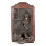 A 19TH CENTURY FIGURAL BRONZE SPILL / VESTA WALL PLAQUE of a dog chasing a boy up a wall, mounted on
