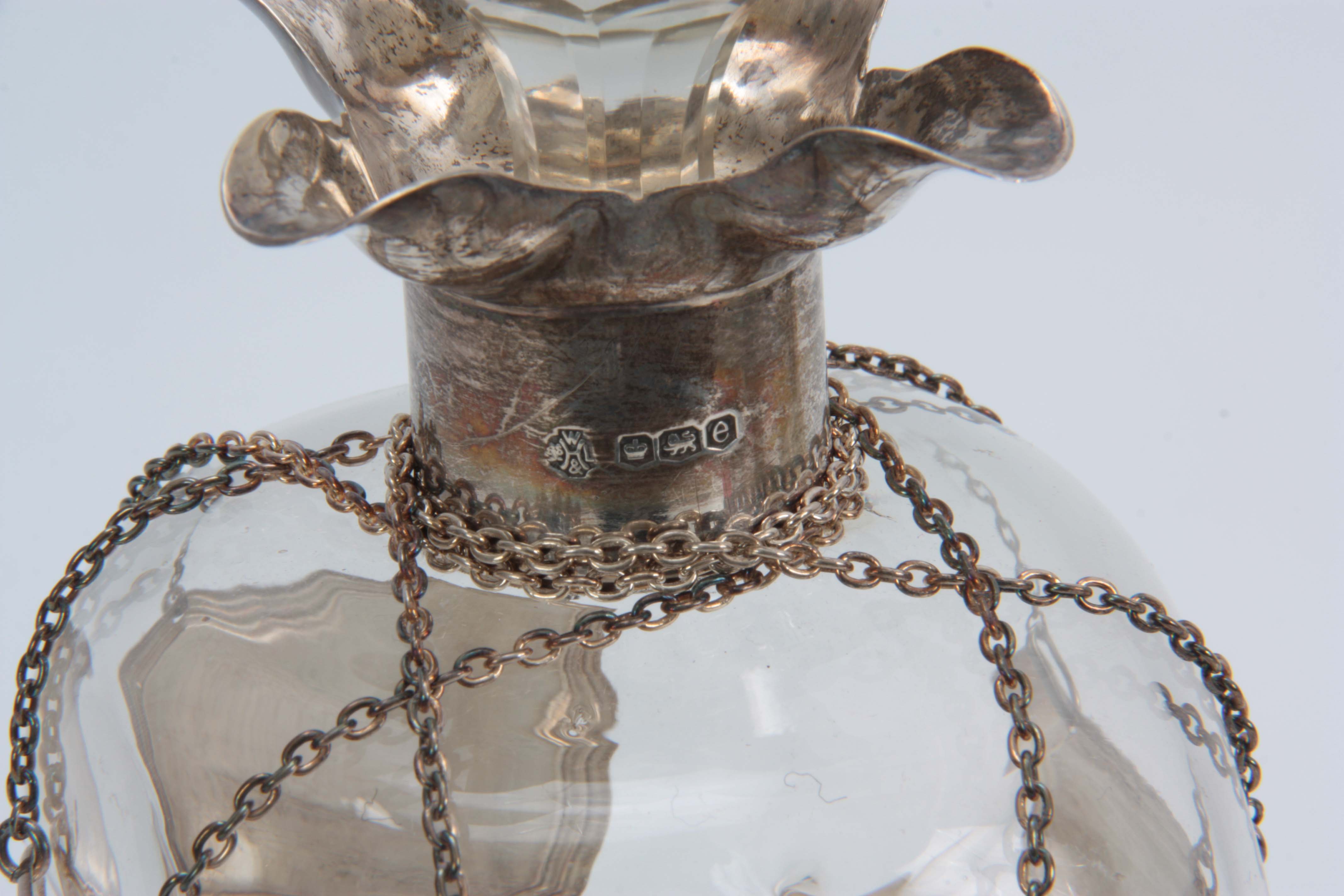 A GEORGE V SILVER MOUNTED SPIRIT DECANTER AND STOPPER with quatrefoil pouring lips and pinched clear - Image 3 of 3