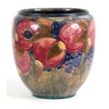 A 20TH CENTURY MOORCROFT JARDINIERE decorated with pomegranates and grapes bearing green signature