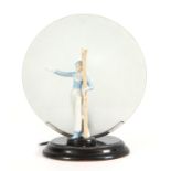 A 1930'S ART DECO CONTINENTAL LAMP mounted with a porcelain figure of a skier having a circular