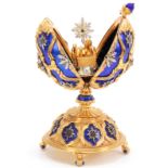 A 20TH CENTURY HOUSE OF FABERGE. THE STAR OF THE NORTH JEWELLED EGG BY THE FRANKLIN MINT gilt silver