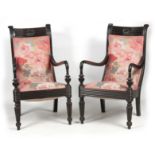 A PAIR OF 19TH CENTURY SOLID EBONY ANGLO INDIAN ARMCHAIRS with reeded shell carved back joined by