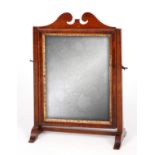 AN EARLY GEORGE III MAHOGANY SMALL DRESSING TABLE MIRROR with adjustable glass and splay feet 28cm